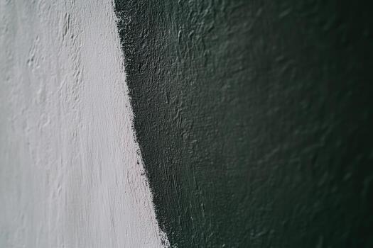 Contrasting textures of black and white paint create a striking visual effect photo