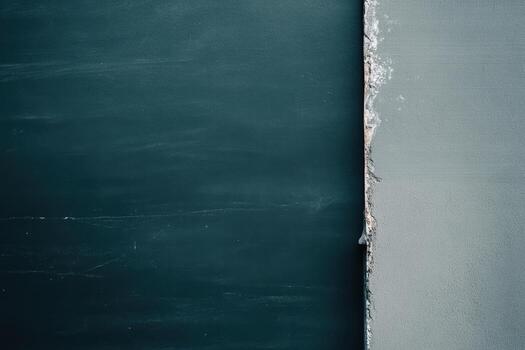 Colorful chalkboard with smooth gray wall section in classroom setting photo