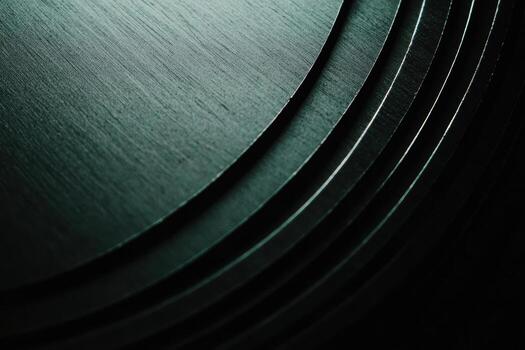 Detailed view of stacked dark wooden circles illuminated by soft light photo