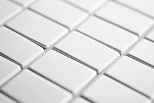 blanco cerámico losas arreglado en un ordenado modelo en un plano superficie foto