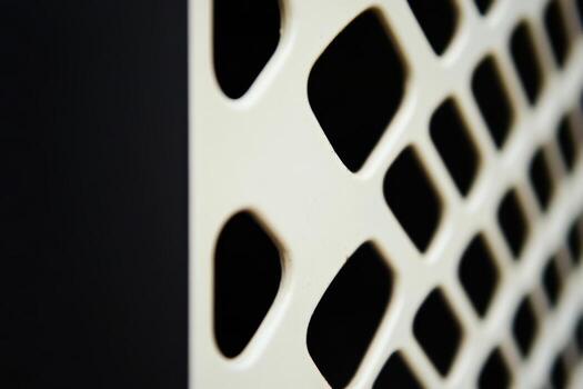 Close-up view of a decorative lattice pattern on a building exterior photo