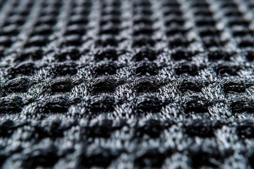 Close-up view of textured fabric showcasing intricate weave patterns photo