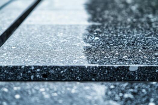 Polished granite surface showcasing intricate patterns and reflections photo