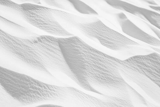Snowy landscape with soft undulating patterns in bright winter light photo