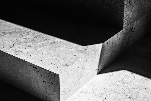 Geometric concrete shapes illuminated by natural light in minimalistic design photo