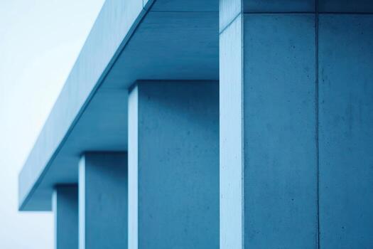 Modern architectural design featuring blue concrete columns at dawn photo
