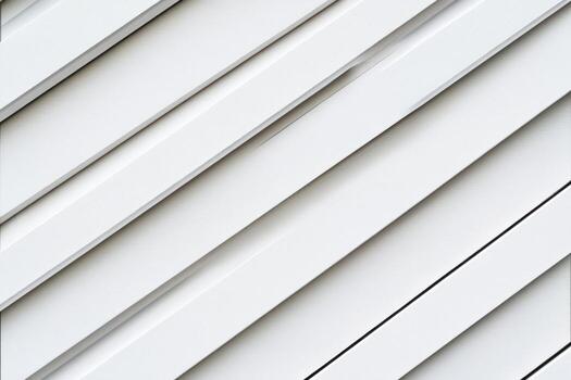 Diagonal lines of white panels create a modern architectural design at noon photo
