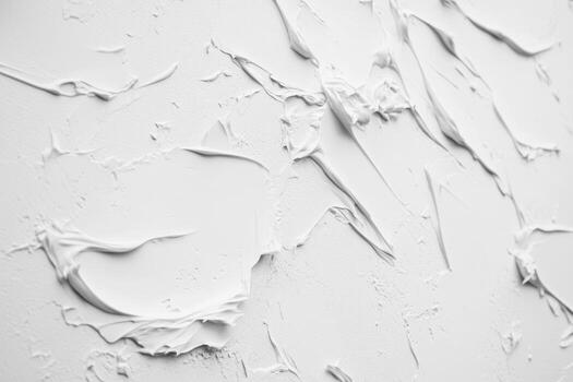 Textured wall with white plaster revealing artistic patterns and designs photo