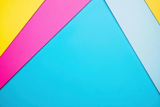 Brightly colored paper sheets arranged in a geometric pattern on table photo