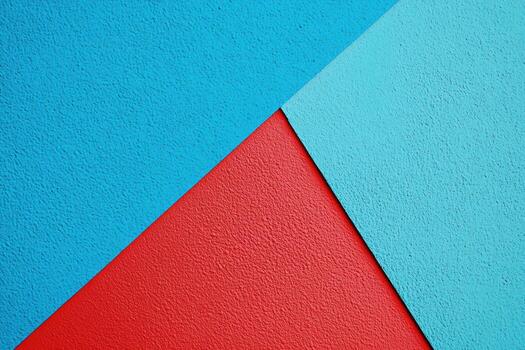Colorful geometric abstraction featuring red and blue textures on surface photo