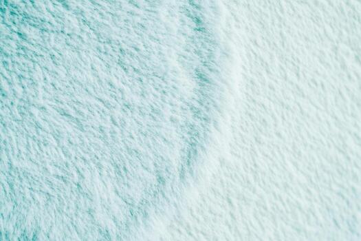 Soft textured surface with gentle curves and subtle color shifts photo