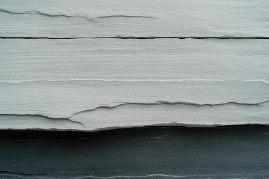 Textured gray and black stone layers showing geological formations and patterns photo