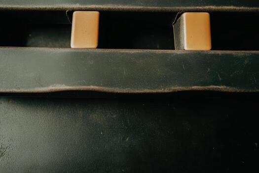 Close-up view of textured surface with two rectangular objects at noon photo