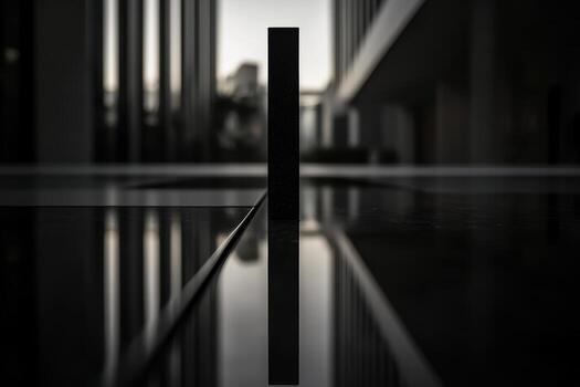 Minimalist reflection of a black object in modern architecture at dusk photo