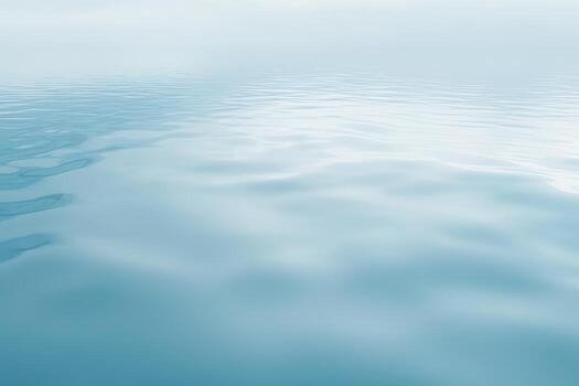 Calm water surface reflecting light on a serene day at the lake photo