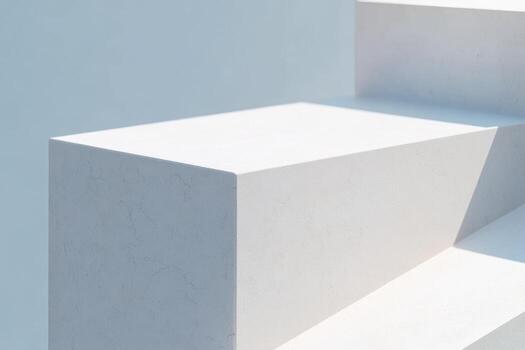Smooth white surfaces reflect sunlight, showcasing precise geometric shapes photo