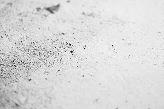 Gray powder spreads across a flat surface during a crafting process photo