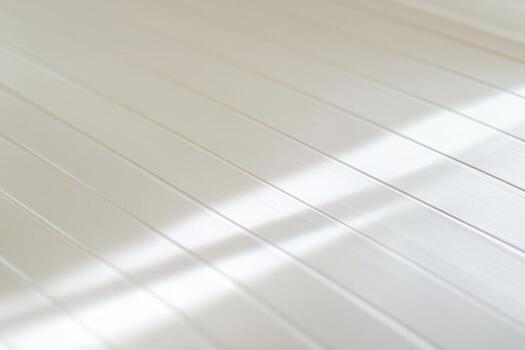 Light reflects on a white textured surface highlighting its patterns and lines photo