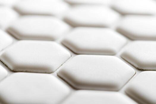 White hexagonal tiles arranged in a modern geometric pattern indoors photo