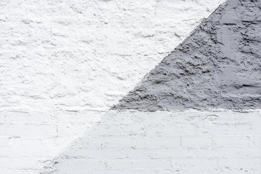 Geometric wall design using gray and white textures in urban setting photo