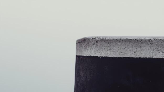 Concrete structure near water with soft sky in the background at dawn photo