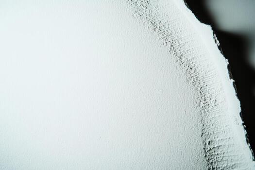 Textured surface of a white wall showcasing unique patterns and details photo