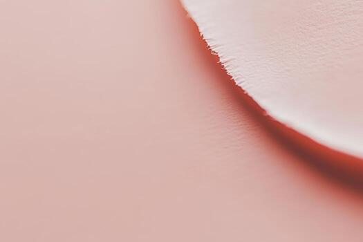 Close-up view of textured paper with soft, warm tones in an artistic setting photo