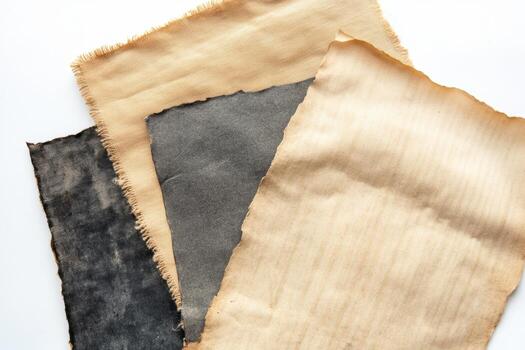 varios texturizado tela hojas desplegado juntos en un blanco antecedentes foto