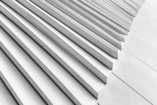 Unique geometric patterns of concrete steps in bright sunlight photo