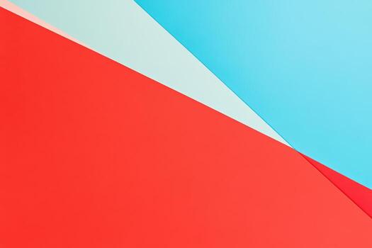 Vibrant geometric design with red and blue shapes on a flat surface photo