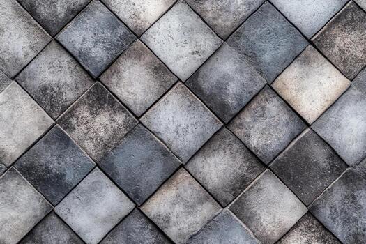 Modern patterned tiles create a textured wall design in grey tones photo
