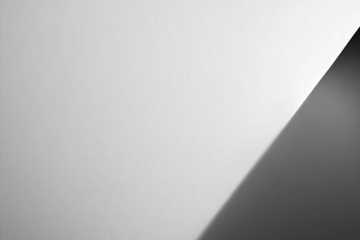 Artistic monochrome play of light and shadow against a smooth surface photo