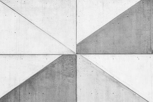Concrete wall with geometric patterns showing shadows and textures photo