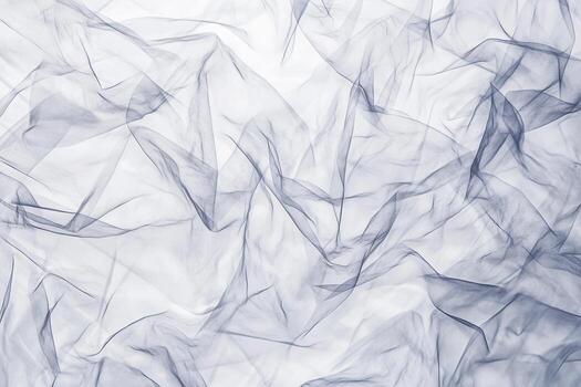 Soft grey fabric with folds and textures against a bright backdrop photo