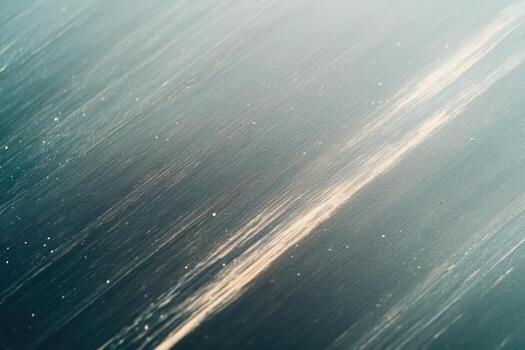 Texture of brushed metal with subtle shine and light streaks in soft lighting photo