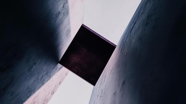 Unique architectural feature captured between two concrete walls at dusk photo