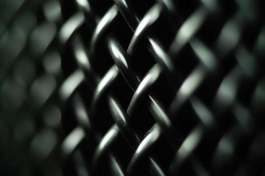 Textured metal mesh close up showcasing intricate patterns and reflections photo