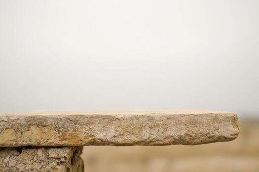 Natural stone surface viewed under a soft cloudy sky on a calm day photo