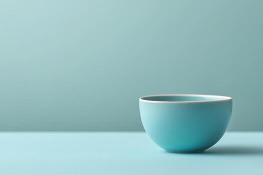 Simple blue bowl against a soft background showcasing modern minimalist design photo