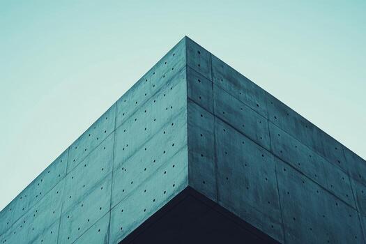 Modern concrete architectural structure against a clear sky background photo