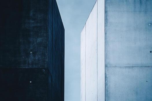 Modern architecture features stark concrete against a cloudy sky photo