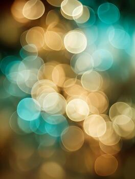 Soft bokeh lights in warm gold and cool turquoise creating a dreamy and abstract festive background with glowing circular shapes and blurred highlights photo