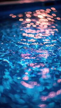 Abstract of shimmering blue water with colorful bokeh reflections and light reflections photo