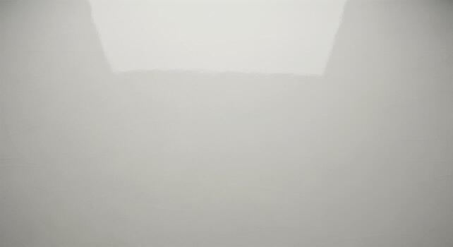 Minimalist abstract background of a smooth curved wall with soft overhead light creating a gentle gradient. photo