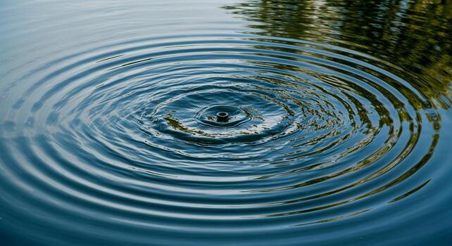 Water Ripples from a Drop Impacting a Calm Surface. photo