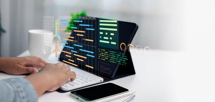 Project Management Dashboard with Gantt Chart and Business Data on Digital Tablet photo