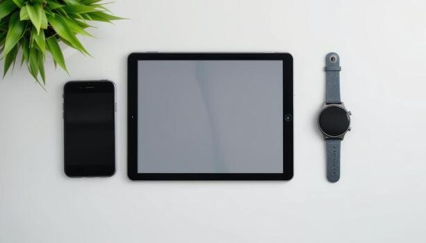 A clean flat lay of modern digital devices photo