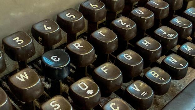 Ancient typewriter keys dusted in nostalgia whisper forgotten tales, steampunk aesthetics, NaNoWriMo inspiration, eternal stories from yesteryears photo