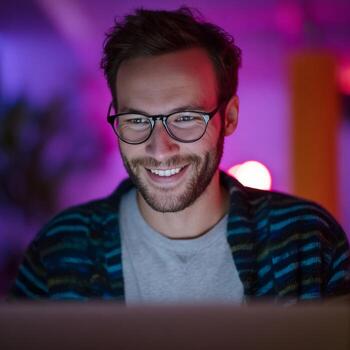 Smiling Caucasian male programmer basking in neon glow, coding under cosmic Skynet, World Backup Day celebration vibe photo