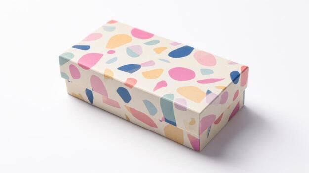 Elegant flat lay of a small rectangular gift box with colorful patterns on a clean surface photo